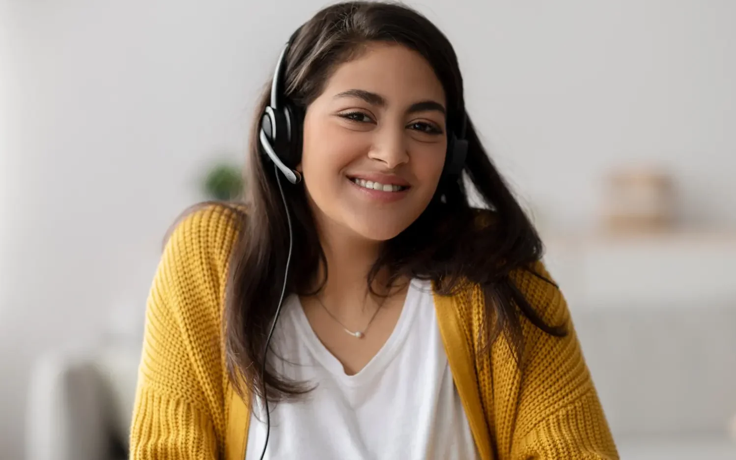 Safety Sure customer service representative with headset, ready to assist clients